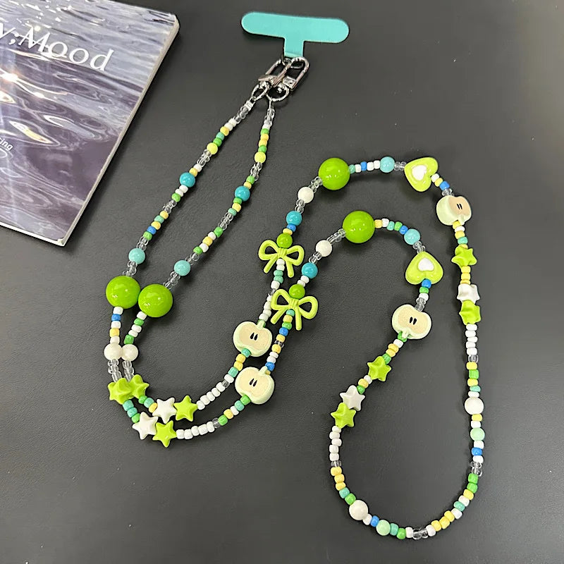 Langes bonbonfarbenes Handyband mit Cartoon-Motiv