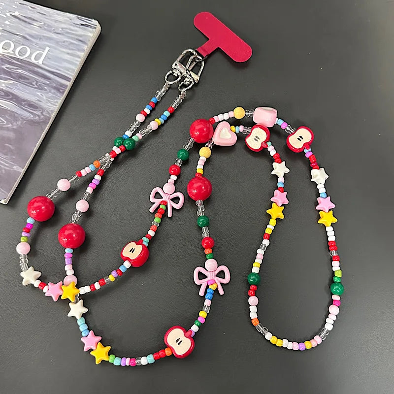 Langes bonbonfarbenes Handyband mit Cartoon-Motiv