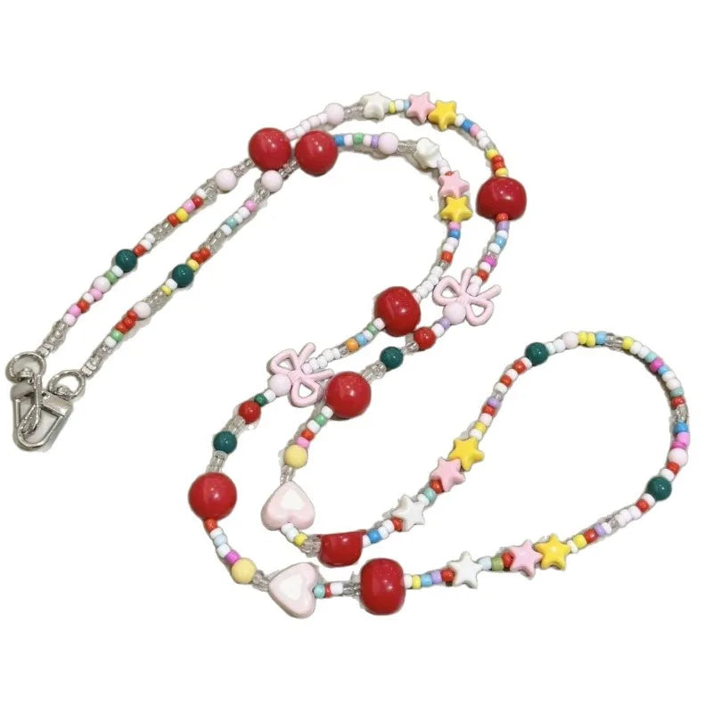 Langes bonbonfarbenes Handyband mit Cartoon-Motiv